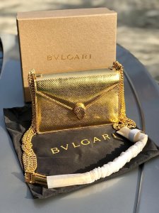 Designer serpentine multichain bag in mesmerising gold.