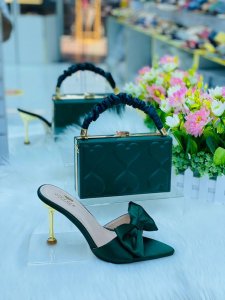 Designer handbag with a footwear